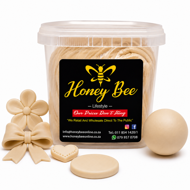 A clear plastic tub of Honey Bee confectionery product with a black label, shown with several beige decorative pieces including a flower, bow, heart, oval, and round disc on a white background.
