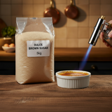 Bag of Dulce Brown Sugar with a creme bréleé being heated with a kitchen torch.