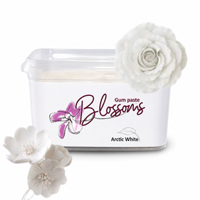 A tub of Blossoms Gum Paste in the shade Arctic White, shown with decorative white fabric flowers on a clean white background.