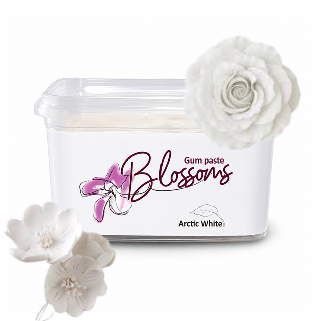 A tub of Blossoms Gum Paste in the shade Arctic White, shown with decorative white fabric flowers on a clean white background.