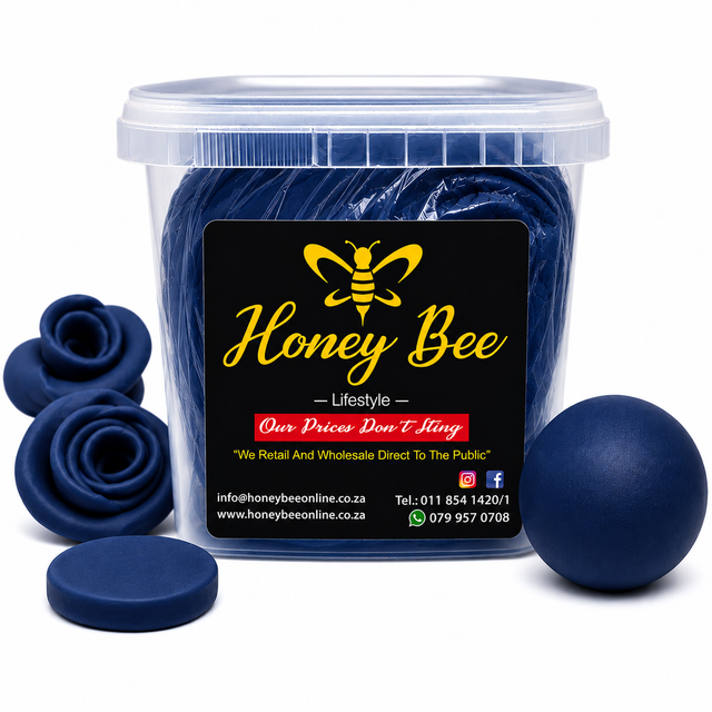 A clear plastic tub filled with dark blue round bath bombs, with three rose-shaped bath bombs and a flat round bath bomb displayed on either side. The front of the tub features a black label with a yellow bee logo and the brand name 'Honey Bee Lifestyle'.