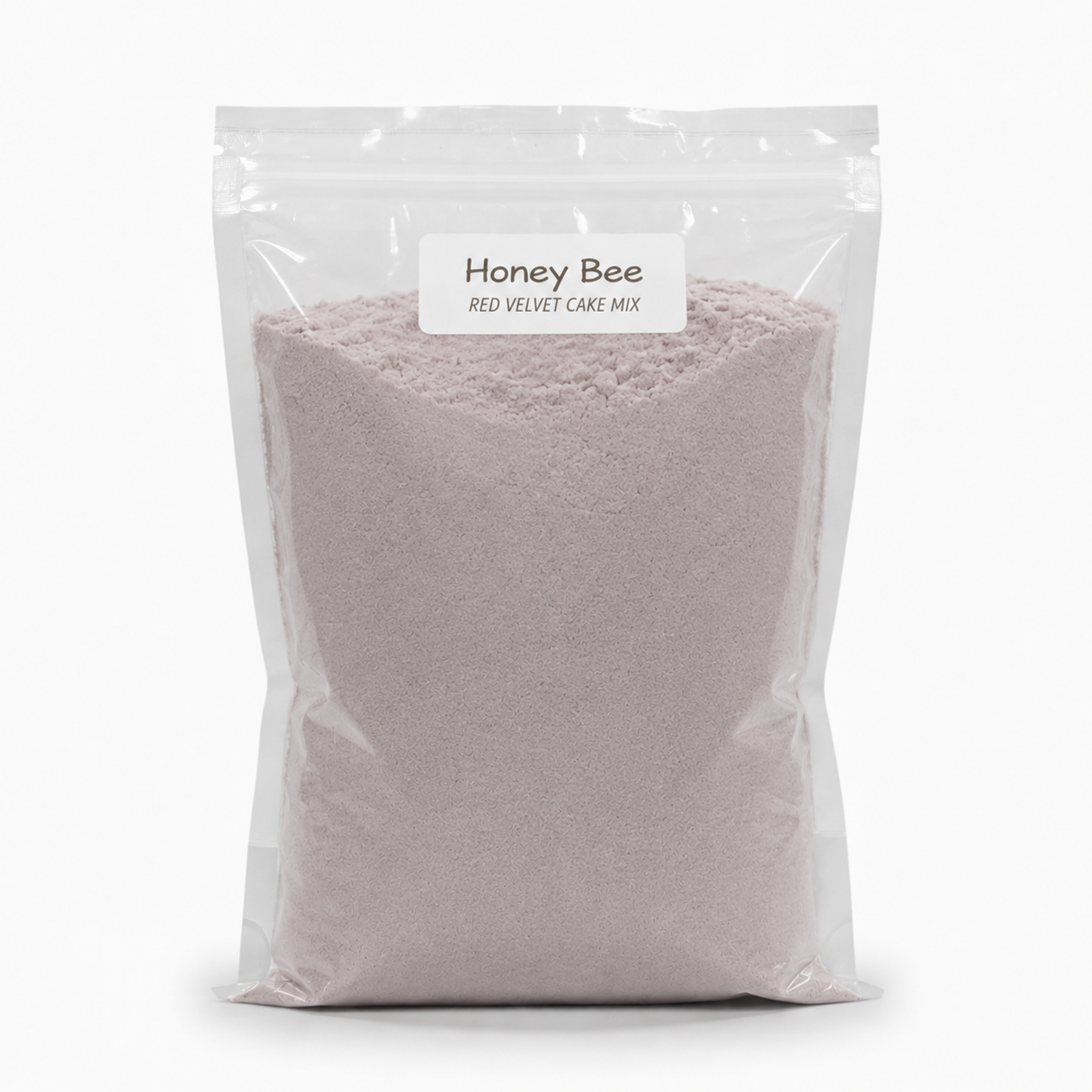 A clear resealable stand-up pouch filled with a pale pink cake mix, labeled 'Honey Bee Red Velvet Cake Mix' on a white background.