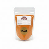 Package of 'Pizza Sprinkle' by Dulce on a white surface with a blurred background