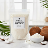 Desiccated coconut package with a bowl of coconut pieces on a light background
