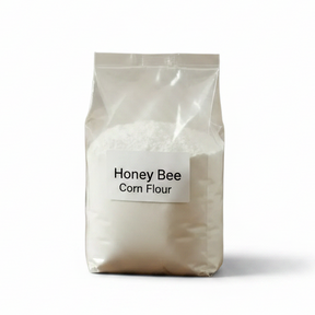 Bag and bowl of Honey Bee Corn Flour on a white background