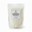 Packaged desiccated coconut with a label on a white background