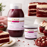 A large and a small jar of Chipkin's Puratos Red Velvet Paste surrounded by red velvet cake slices, cupcakes, and a chocolate cookie on a white marble surface.